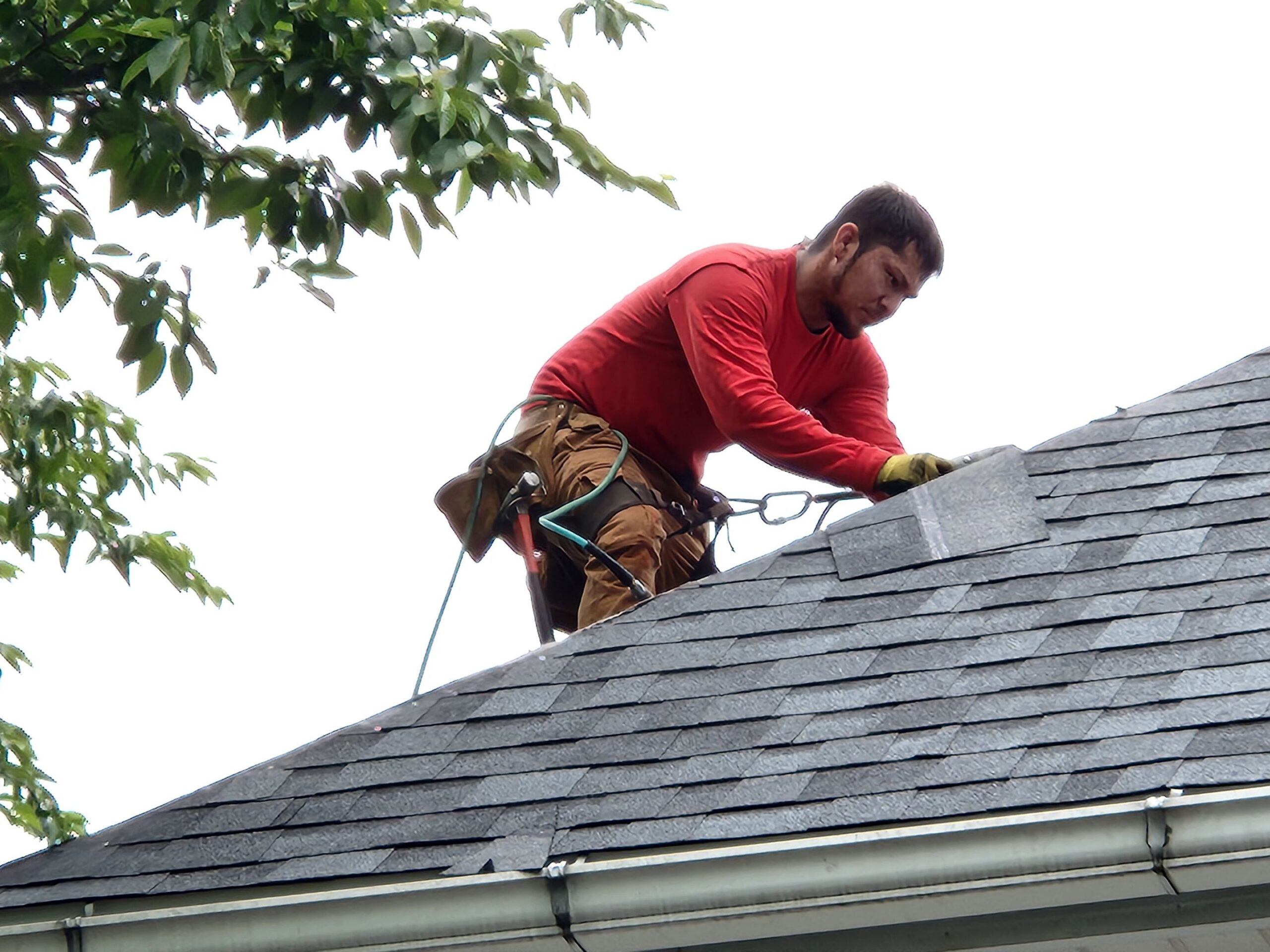 Person repairing a roof on a home. 