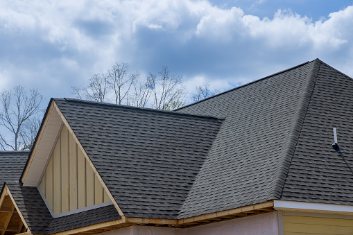 New house in covered corner roof shingles in Owings Mills & Reisterstown, MD